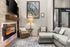 Cozy living room featuring a modern fireplace, elegant artwork, and plush seating in a stylish, well-lit space.