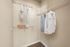 Spacious and organized walk-in closet with modern shelving, perfect for ample storage.