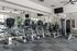 Modern fitness center with state-of-the-art cardio machines and weight training equipment, ideal for a healthy lifestyle.