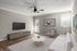 Inviting living room with modern decor, cozy seating, chic artwork, and natural light.