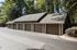 Charming multi-car garage nestled in a serene wooded setting, perfect for secure and convenient parking.