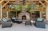 furnished patio area with seatingand fireplace