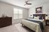 furnished bedroom in apartment home