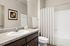 furnished bathroom with sink, toilet and bathtub in apartment home