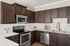 furnished kitchen area of apartment home