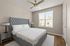 furnished bedroom in apartment home