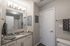 Modern bathroom with granite countertop, stylish lighting, and elegant fixtures, offering a clean and inviting space.