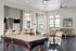 Chic recreation room with billiards table, seating area, and modern decor.