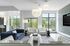 Modern clubhouse with elegant seating, statement lighting, and expansive windows showcasing a garden view.