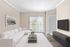 Bright and modern living room featuring a sleek white sofa, large wall-mounted TV, and floor-to-ceiling windows with soft natural light.
