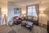 Model apartment living room with comfortable furniture and decorations