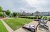 Outdoor lounge at our apartments for rent in Louisville, featuring beach chairs, shade structures, and outdoor couches.