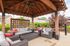 Outdoor lounge at our apartments for rent in Louisville, featuring beach chairs, shade structures, and outdoor couches.