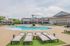 Outdoor lounge at our apartments for rent in Louisville, featuring beach chairs, shade structures, and outdoor couches.