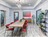 Co working space at our apartments in Tuscaloosa, featuring wood grain floor paneling and a conference table.