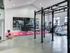 The fitness center at our apartments in Tuscaloosa, featuring weights, treadmills, pull up bars, and exercise equipment.