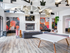 Community clubhouse with comfortable seating, a large tv, ping pong table and other games.