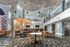 Community clubhouse with plenty of tables and chairs for residents to utilize