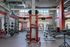 First floor of the fitness center with various workout equipment machines and free weights