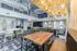 Community clubhouse with plenty of tables and chairs for residents to study, work, or entertain in