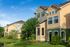 The exterior of our student living apartments in Orlando, FL, featuring a view of the stucco facades and apartment windows.