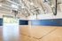 The racquetball court at our student apartments near Penn State, featuring a view of the fitness center.