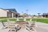 Outdoor lounge at our student apartments near Penn State, featuring grill stations and counter seating.