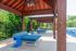 Outdoor lounge at our student apartments near Penn State, featuring grill stations and counter seating.