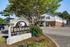 Charming Foxhaven Apartments with lush greenery, showcasing modern 1 and 2-bedroom units in a serene community setting.