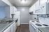 Kitchen with white appliances and gray counters at Deerfield Apartments in Memphis, TN
