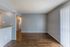 Open living room with vertical blinds at Deerfield Apartments in Memphis, TN