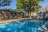 Swimming pool with buildings beyond at Deerfield Apartments in Memphis, TN