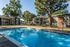 Pool surrounded by shade trees at Deerfield Apartments in Memphis, TN