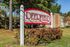 Deerfield monument sign with landscaping at Deerfield Apartments in Memphis, TN