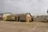 Brick building with open parking at Bent Creek Apartments in West Memphis, AR