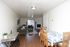 Open living and dining area with wood-style floors at Braewood in Murray, UT