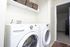 In-unit laundry with a front-load washer and dryer at Braewood in Murray, UT