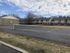 Tennis court beside two-story apartment buildings at Braewood in Murray, UT