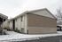 Brick and siding building on a snowy winter day at Braewood in Murray, UT