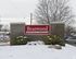 Brick entrance sign with snowy landscaping at Braewood in Murray, UT