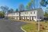 Row of townhomes along the parking lot at Collier Village Apartments in Collierville, TN
