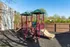 Playground with slides on mulch at Collier Village Apartments in Collierville, TN