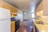 Kitchen with white refrigerator and dining space at Countryside Village in Memphis, TN