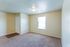 Carpeted bedroom with window at Countryside Village in Memphis, TN