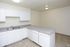 Kitchen with white cabinets and a double sink at Fairbrook in Salt Lake City, UT