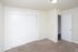 Bedroom with a wide double-door closet at Fairbrook in Salt Lake City, UT