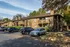 Two-story apartment buildings with resident parking at Hickory Forest in Memphis, TN