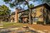 Townhome buildings with a wide green lawn at Hickory Forest in Memphis, TN