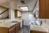Kitchen with wood cabinets and white appliances at Hickory Forest in Memphis, TN
