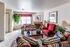 Furnished model living room with fireplace at Hickory Forest in Memphis, TN